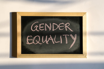 Obraz premium Gender Equality, words written with chalk on board
