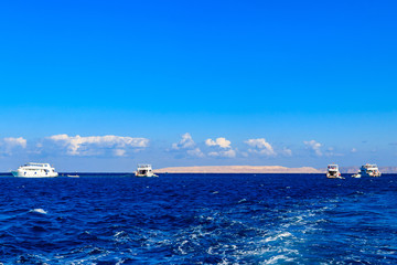 View of Red sea and white yachts on horizon near Hurghada, Egypt