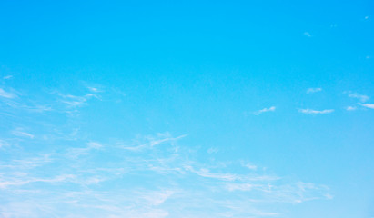 Blue sky background and white clouds soft focus, and copy space