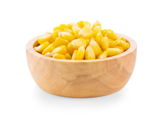 Corn seeds in wood bowl isolated on the white background