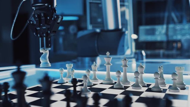 Close Up Shot of a Artificial Intelligence Operating a Futuristic Robotic Arm in a Game of Chess Against a Human. Robot Moves a Knight. They are in a High Tech Modern Research Laboratory.