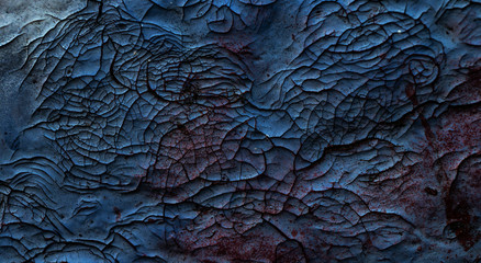 Rissiges rot blaues Farbmuster