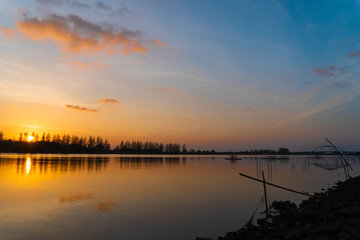 Obraz premium View of waterproof dam with sunset sky background.