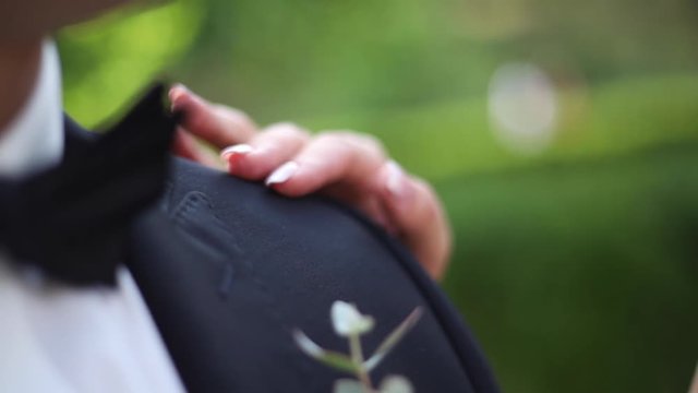Closeup hand groom and bride. Elements of wedding. Suit and dress