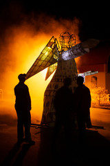 Paper and timber framed angel figure catches on fire