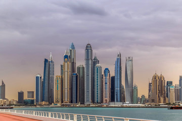 Fototapeta premium Dubai Marina Skyline Under Dramatic Cloudy Sky, United Arab Emirates