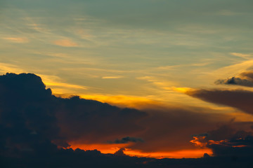 sunset sky back on dark silhouette cloud red lava flame hole of sun ray last light