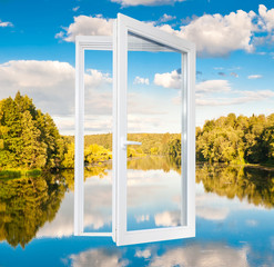 Window and landscape with forest, river and white clouds on the blue sky