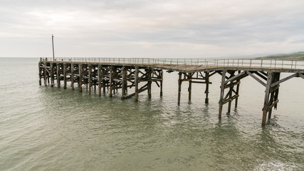Damaged pier and the sea in Trefor, Gwynedd, Wales, UK
