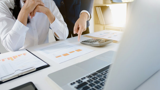 Executives coperate, Business People explaining a valuation data in modern office.