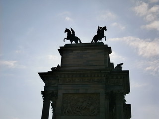 Side view of the decorations and sculptures of the Arc de Triomphe in Milan