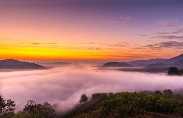 Fototapeta premium Viewpoint of the sea mist over the Mekong Rive in Laos and beautiful sunrise viewpoint,nature,travel at Phu Huay Isan,Nong Khai,Thailand