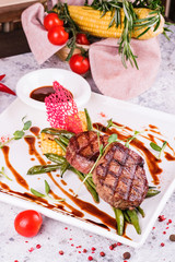 grilled beef steak with vegetables and sauce