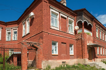 Fototapeta na wymiar Borovichi, Russia - August 8, 2018: Residential building in the city center. Novgorod region, Borovichi, Russia