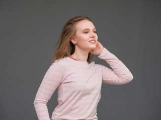 portrait of soncept young cheerful long-haired brunette woman standing in casual clothes, shaking...
