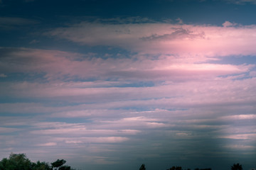 Fototapeta na wymiar Lenticular Clouds in a pinkish dramatic sky