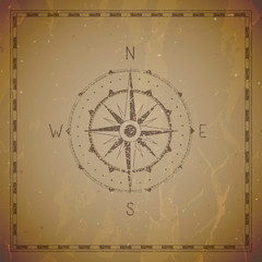 Fototapeta premium Vector illustration with a vintage compass or wind rose and frame on grunge background.