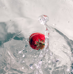 strawberry dropping in the water