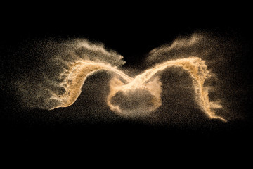 Golden dry river sand explosion isolated on white background. Abstract sand splashing.