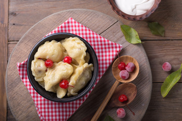 Ukrainian Pierogi - sweet dumplings with cherry and cottage cheese filling