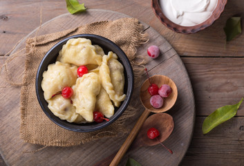 Ukrainian Pierogi - sweet dumplings with cherry and cottage cheese filling