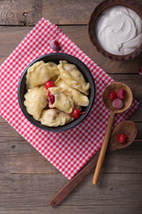 Ukrainian Pierogi - sweet dumplings with cherry and cottage cheese filling