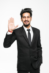 Young indian businessman shows his hand hello isolated on white background.