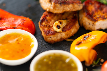 Grilled pork fillet medallions with vegetables