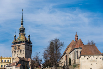 Obraz premium Functional medieval clock on the tower with moving hand carved wood dolls.