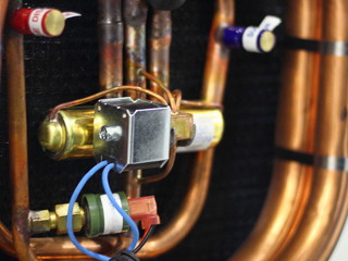 Close up relay of air conditioner, copper tubes and fittings - repair, maintenence A/C