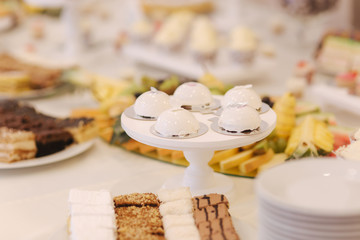 Candy bar in restaurant on the wedding. Sweet cake and sweets