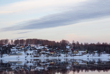 winter village reflection in the river