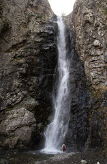 Fototapeta na wymiar man in waterfall