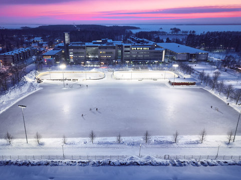 Aerial View Of A Huge Ice Rink On The Background Of A Beautiful Sunset