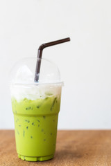 iced green macha tea wooden table