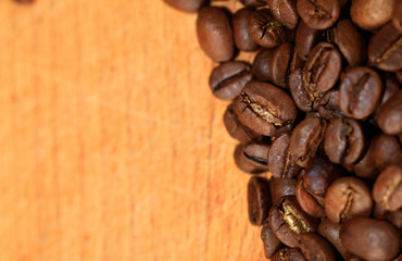 Fried coffee beans close-up - excellent morning breakfast. Black Espresso.