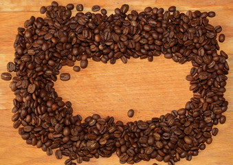 Fried coffee beans close-up - excellent morning breakfast. Black Espresso.