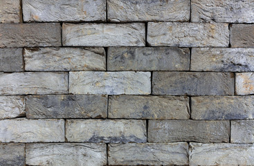 The texture of the stone wall of the old brick. Italian building stone. Historical Masonry.