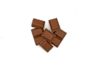 Milk chocolate pieces - isolated on white