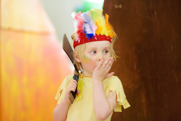 Little boy involved in performance children's theatre Studio in the role of the American Indian.