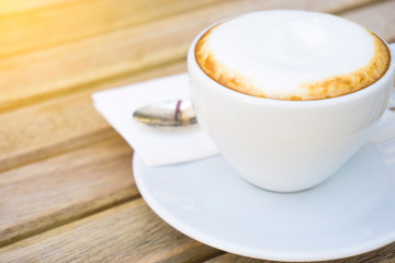 Coffee cup on the wooden desk