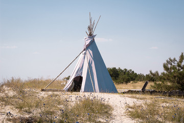 Summer vacation camping tent, indian wigwam hut, in dry wild nature prairie steppe desert © Vera Verano