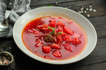 red tomato soup with vegetables, meat. first course. top.  food background. copy space