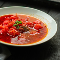 red tomato soup with vegetables, meat. first course. top.  food background. copy space