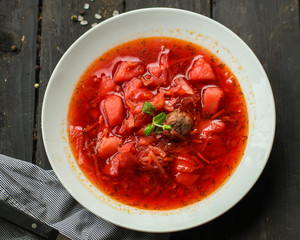 red tomato soup with vegetables, meat. first course. top.  food background. copy space