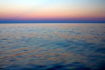 Naklejka na ściany i meble Evening sea with horizon