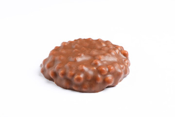 Chocolate cookie with caramel filling on white background
