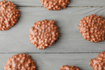 Flat lay composition with chocolate cookies on wooden background