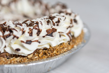 Closeup of delicious cream pie ready to server, Cream and chocolate topping