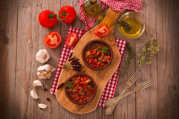 Marinated pork loin in tomato sauce.